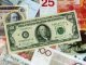НБУ повысил курс доллара до 12,97 гривен, курс евро - до 18,00 гривен